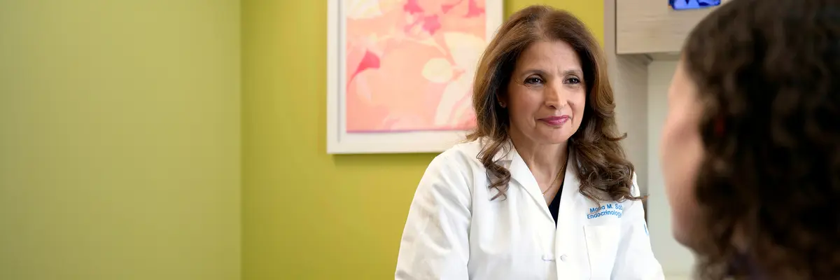 Endocrinologist Dr. Mona Sabra, an expert in thyroid disorders, talks with her patient.