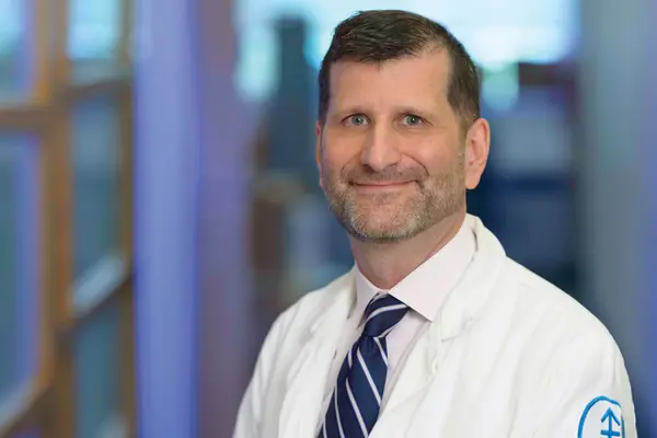 Genitourinary medical oncologist Dr. Michael Morris, standing in an MSK hallway, is part of a new MSK program for improving treatment for neuroendocrine cancers. 