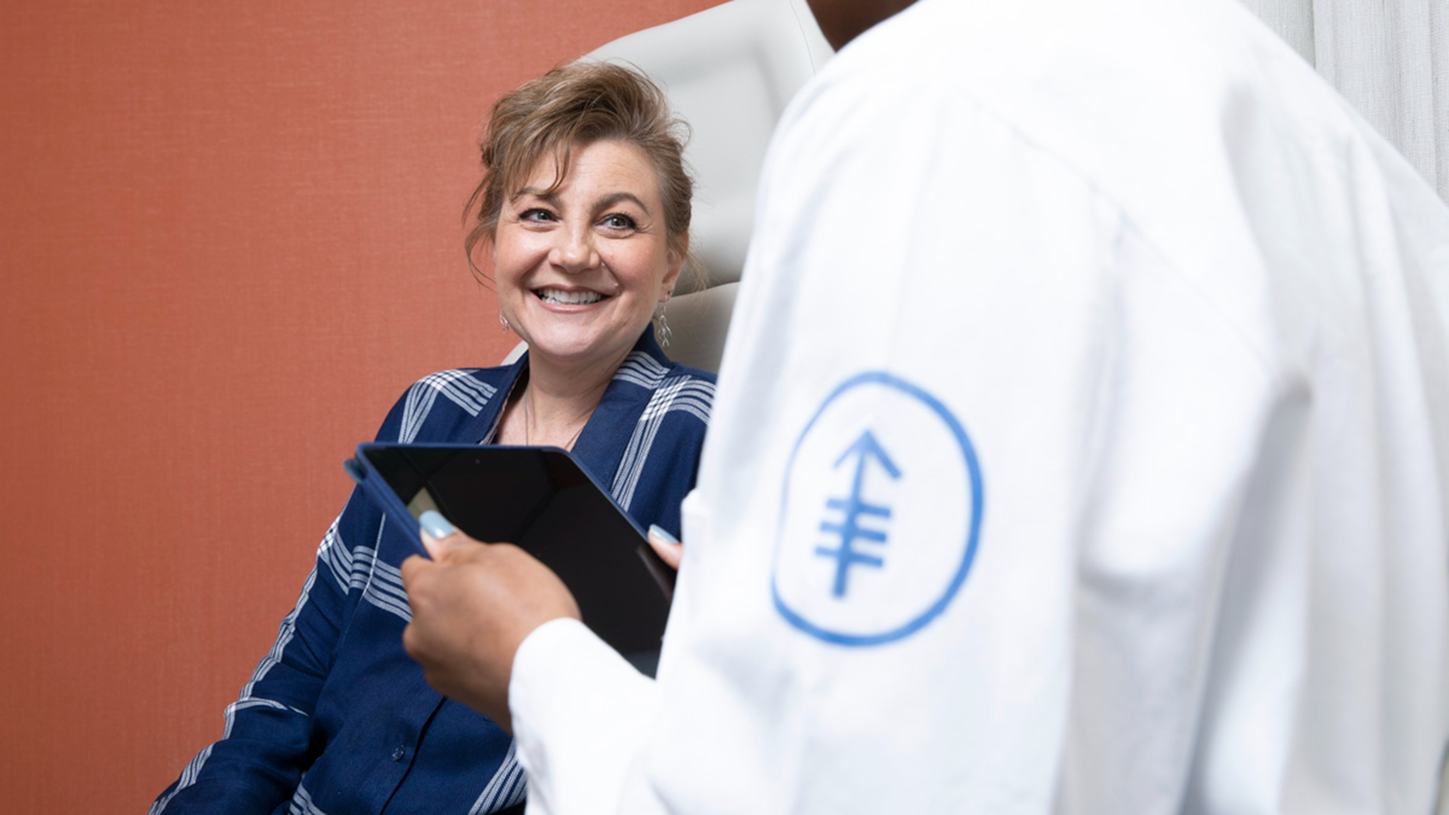 An MSK nurse in an exam room with a patient during her appointment. 