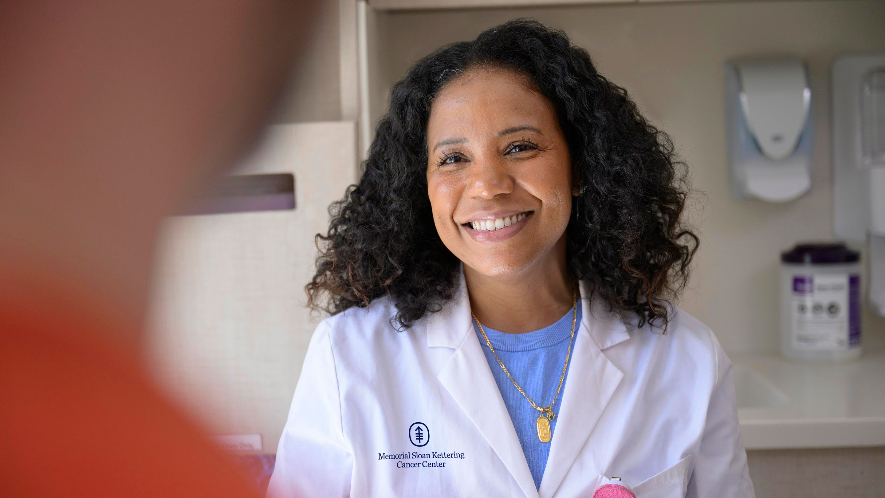 Nurse practitioner Desiree Robinson, an expert in caring for people with urological cancers, talks with her patient. 