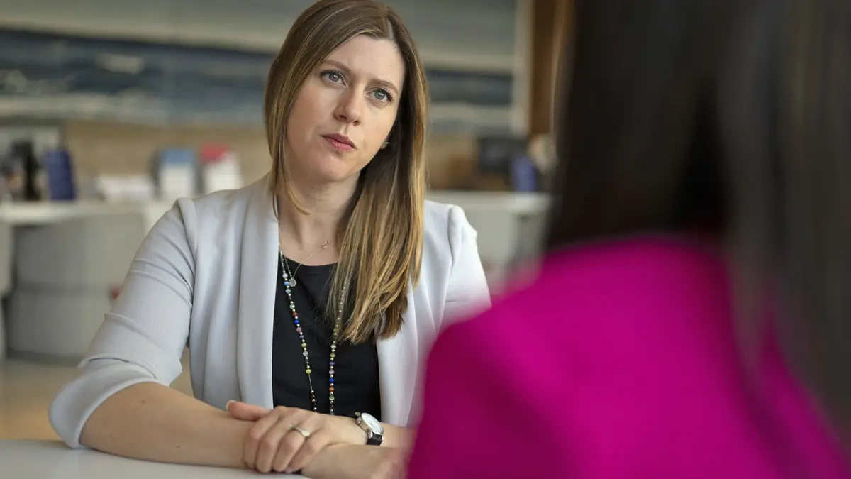 An MSK social worker is sitting and talking with her patient. 