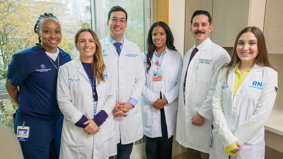 Six members of MSK’s prostate cancer care team, standing in an MSK hallway. 