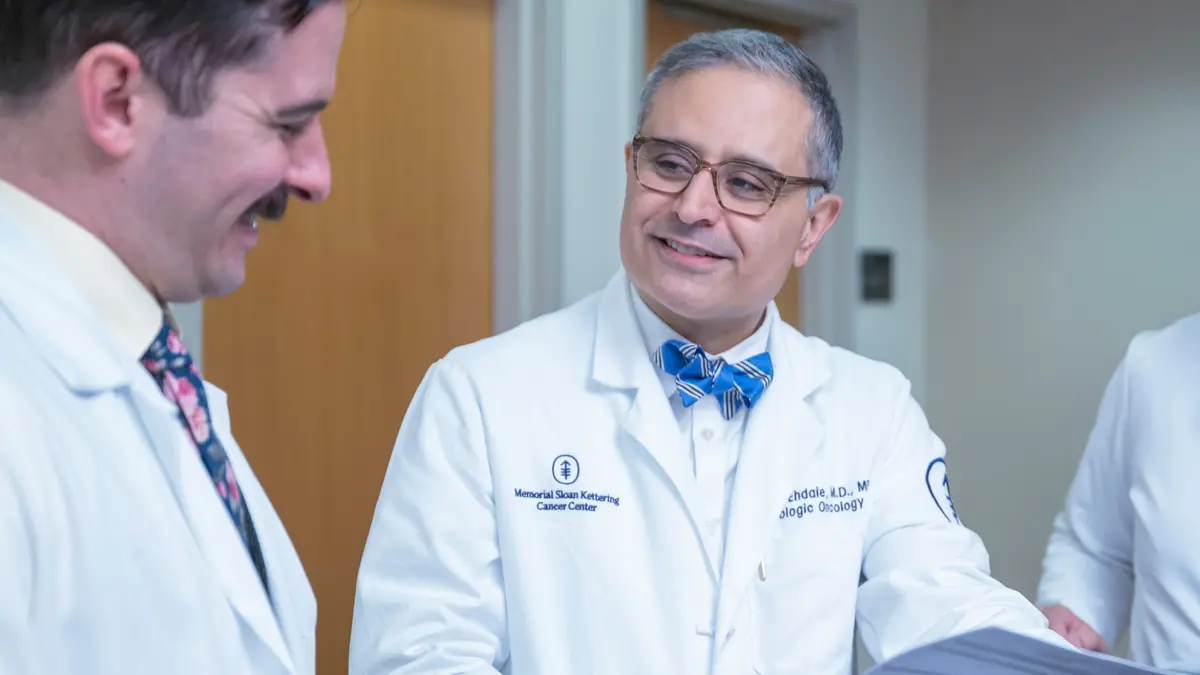 Dr. Ehdaie and physician assistant Nicholas Romano talk together at an MSK clinic. 