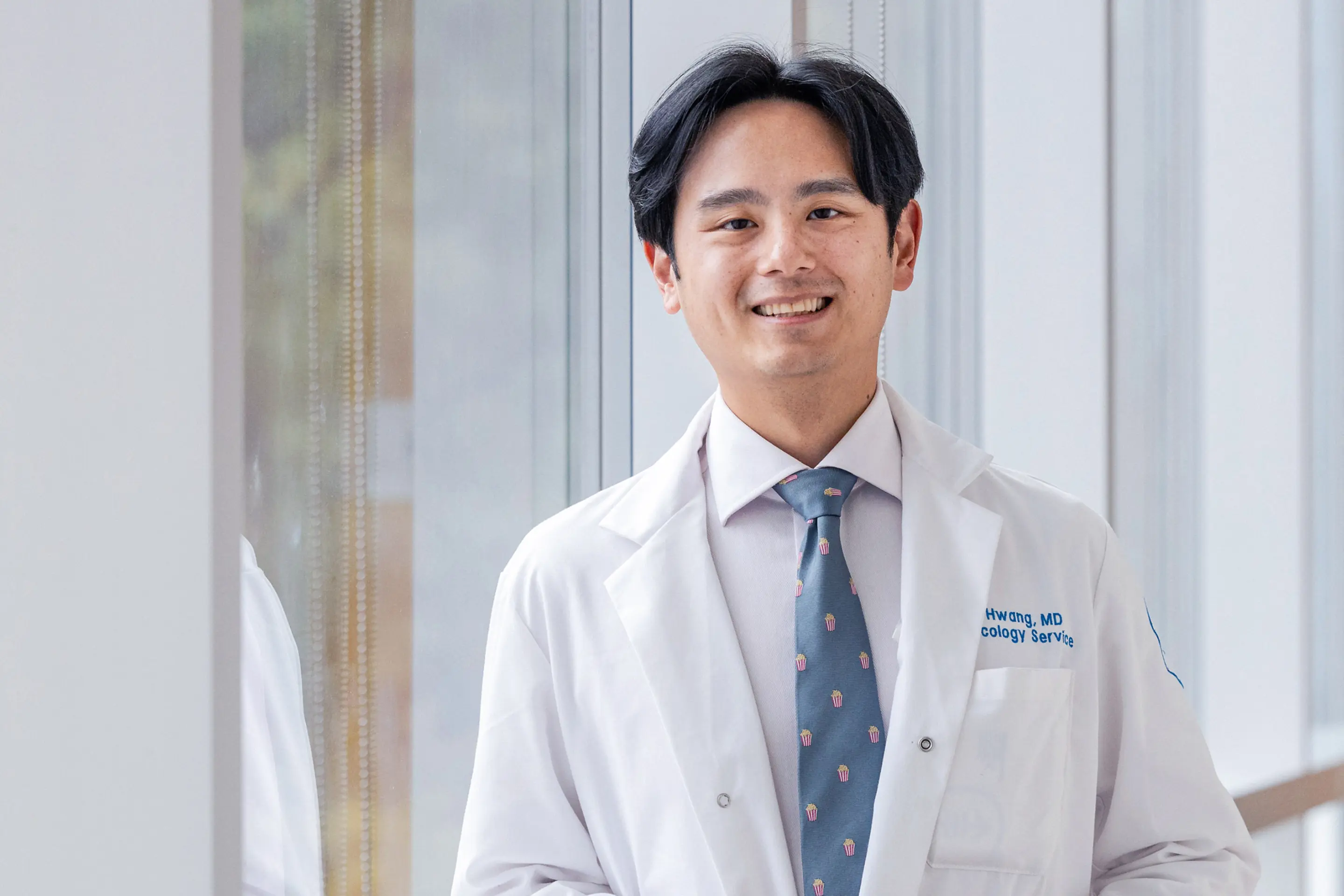Head and neck medical oncologist Dr. Michael Hwang talks with his patient at MSK in Commack on Long Island. 