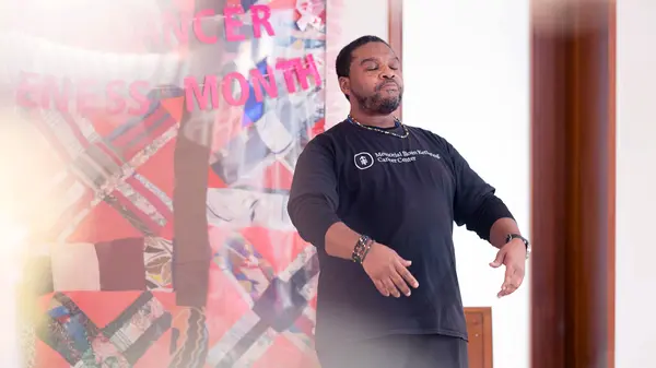Malik Cadwell, Mind Body Instructor at a breast cancer awareness community event at MSK's Ralph Lauren Center.