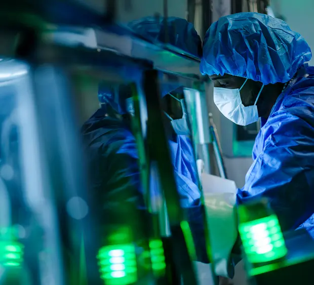 Researcher using advanced laboratory technology to develop new cancer treatments.